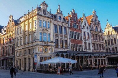 600 Years of History and Heritage: A Self-Guided Walking Tour of Leuven - The market square and church-site resilience you’ll actually notice