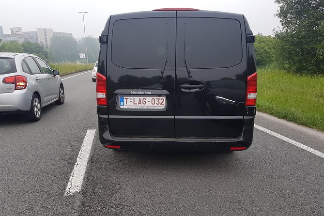 Luxury Minivan from Charleroi airport to the city of Brussels - Meeting your driver: Leonidas Chocolate Shop in Terminal 1
